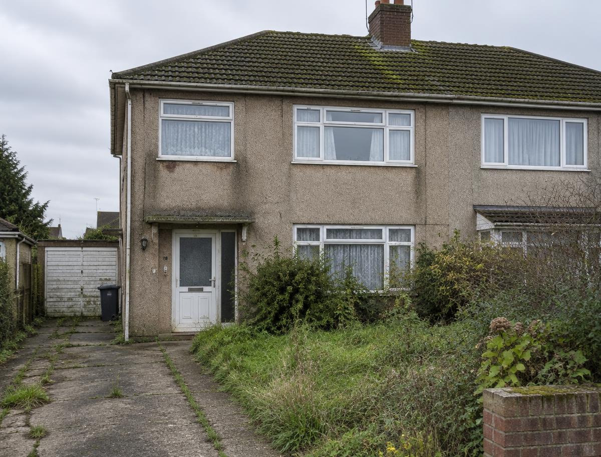 Conceptual house before renovation: dated pebbledash and overgrown garden